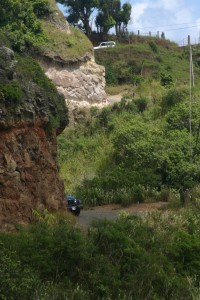 Steep, narrow, cliff-edge driving. See the white car following a bit behind the blue Jeep?
